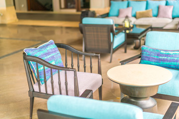 Closeup of modern furniture with pillows .