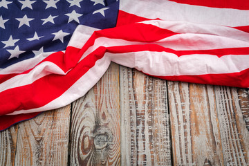 American flag on wood background .