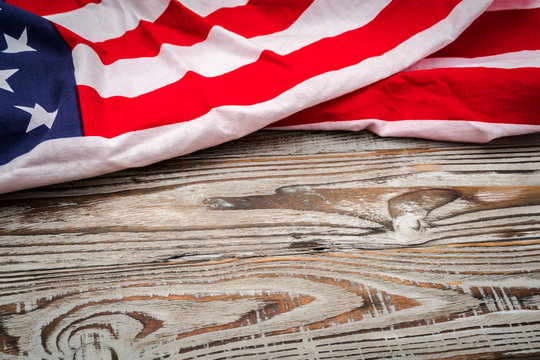 American flag on wood background .