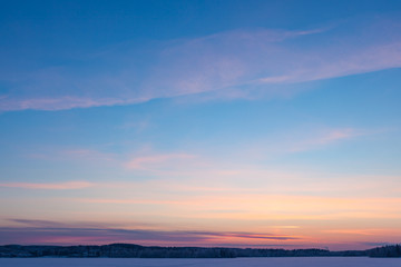 Naklejka na ściany i meble Serene sunset sky at winter