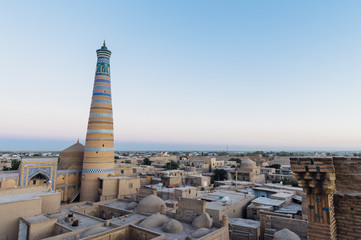 Fototapeta na wymiar Islam Khoja (Khodja) Minaret in Itchan Kala, the walled inner town of the city of Khiva, Uzbekistan. UNESCO World Heritage