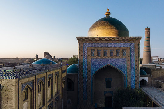 Pahlavon Mahmud Mausoleum view at the sunset time in Itchan Kala, the walled inner town of the city of Khiva, Uzbekistan. UNESCO World Heritage Stock Photo | Adobe Stock