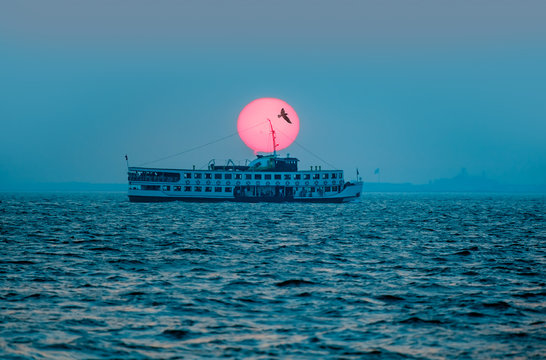 Izmir ferry services in the Gulf of Izmir at sunset