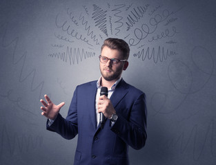 Businessman holding microphone