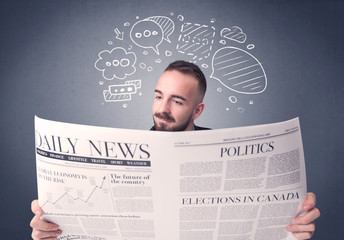 Businessman reading newspaper