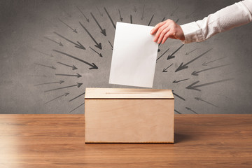 close up of a ballot box and casting vote