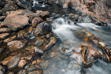 Water flow on brown rocks
