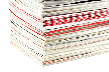 close up on stacking magazines isolated on white background