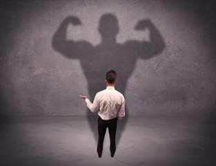 Successful businessman with strong shadow