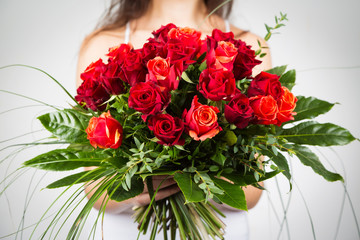 Woman Holding Bouquet Of Roses