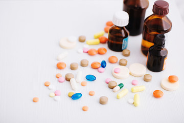different  pills  mix  on white wooden background