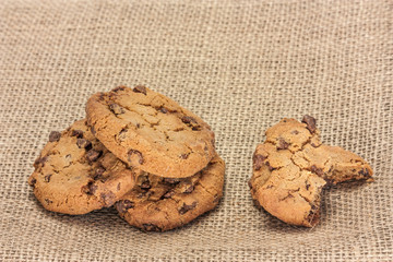 Chocolate chips cookie on burlap texture, with copyspace