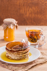 Pancake with honey and tea
