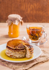 Pancake with honey and tea