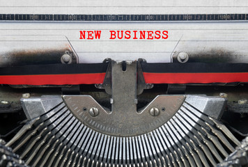 NEW BUSINESS Typed Words On a Vintage Typewriter Conceptual
