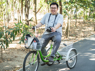 Male is riding the bicycle in the park