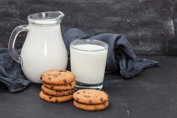 Oatmeal chocolate chip cookies and milk jug. Healthy eating.