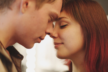 Romantic couple touching and kissing each other