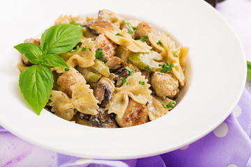 Pasta with meatballs and mushrooms in creamy sauce