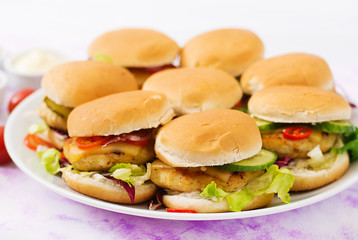 Mini hamburgers with chicken burger, cheese and a vegetables