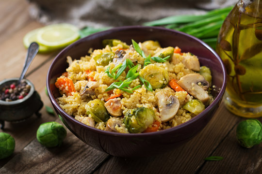 Vegetarian couscous salad with brussels sprouts, mushrooms, carrots and spices. Fitness food. Proper nutrition.
