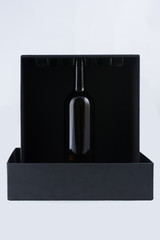 black box with a wine bottle
