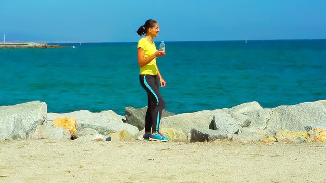 Couple running next to the navy blye sea, steadycam shot, slow motion shot
