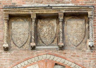 Coat of arms on the Palazzo della Ragione . Mantua, Italy