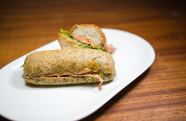 Bread sandwich on a white plate.