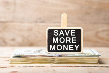 Dollar bills, blackboard with text 