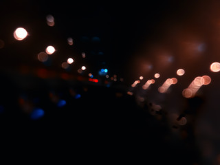 Night city lights on highway bokeh backdrop