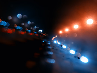 Night city lights on highway bokeh backdrop