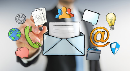 Businessman drawing manuscript contact icon with a pen