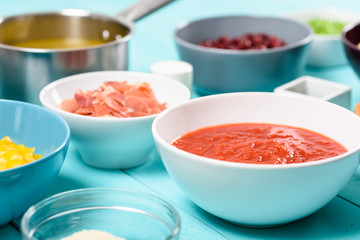 Tomato Sauce And Food Ingredients On Turquoise Kitchen Table