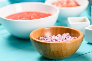 Chopped Red Onions And Food Ingredients On Turquoise Kitchen Table