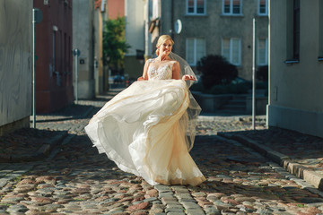 bride dances on city street