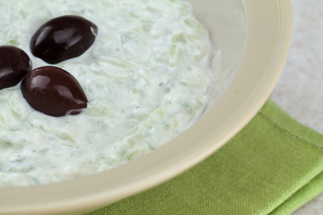 Tzatziki sauce in bowl, close up