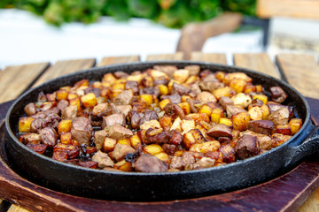 The Azerbaijan cuisine. Fried potatoes with meat and liver