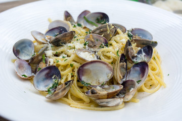 Food : Spaghetti vongole. Seafood pasta with clams on white plate 