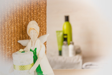 Fototapeta na wymiar Tilda Doll with cotton buds/bathroom interior