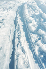 cross-country skiing trail in the snow on a sunny winter day