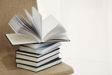 Pile of books on chair, closeup