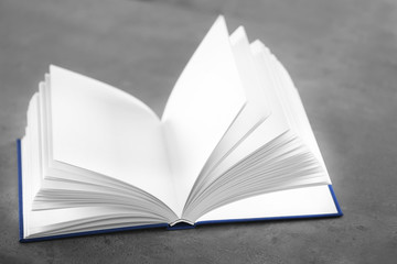 Opened book on table, closeup