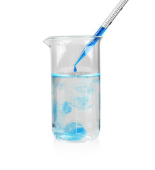 Beaker with color water and glass pipette on white background