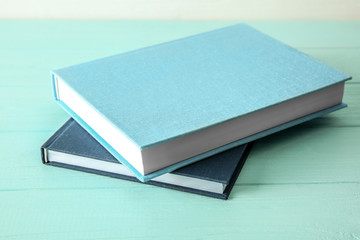 New books on wooden table, closeup