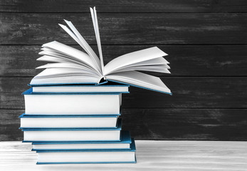 New books on wooden  background