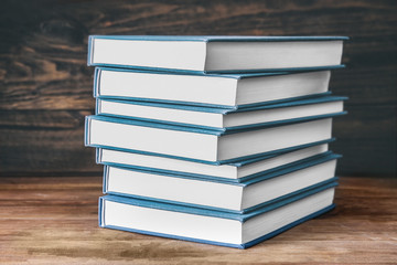 New books on wooden  background