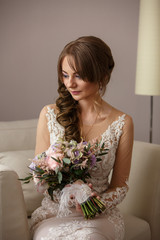 Portrait of beautiful bride with wedding bouquet