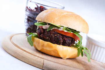 Vegetarian burger with cheese and vegetables