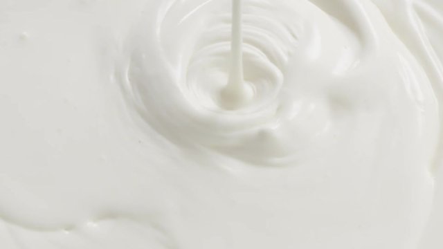Slow motion of cream or yogurt pouring, 180fps prores footage